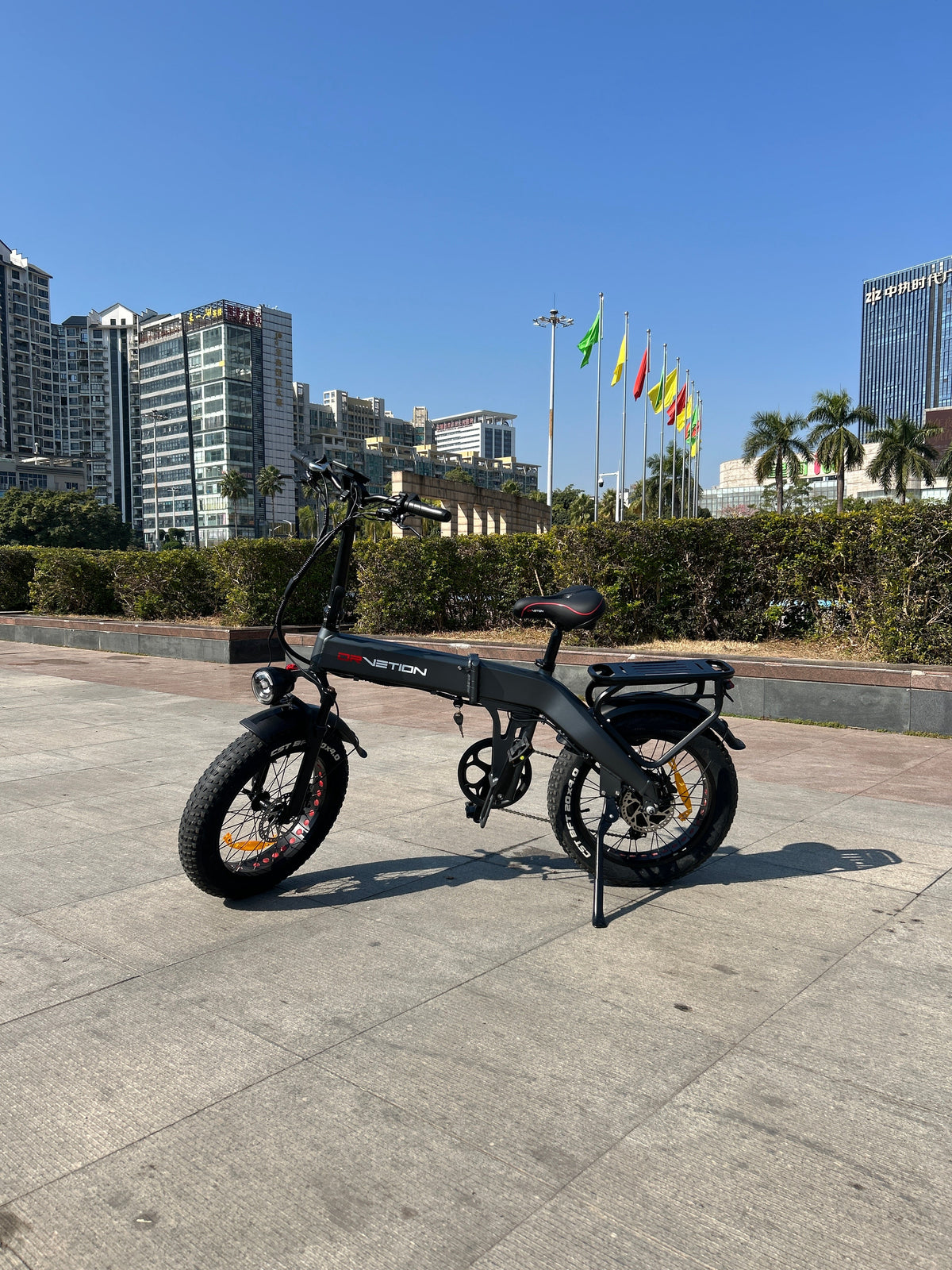 Drvetion BT20 — e-bike side view in an open plaza