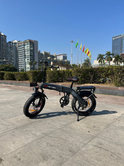 Drvetion BT20 — e-bike side view in an open plaza