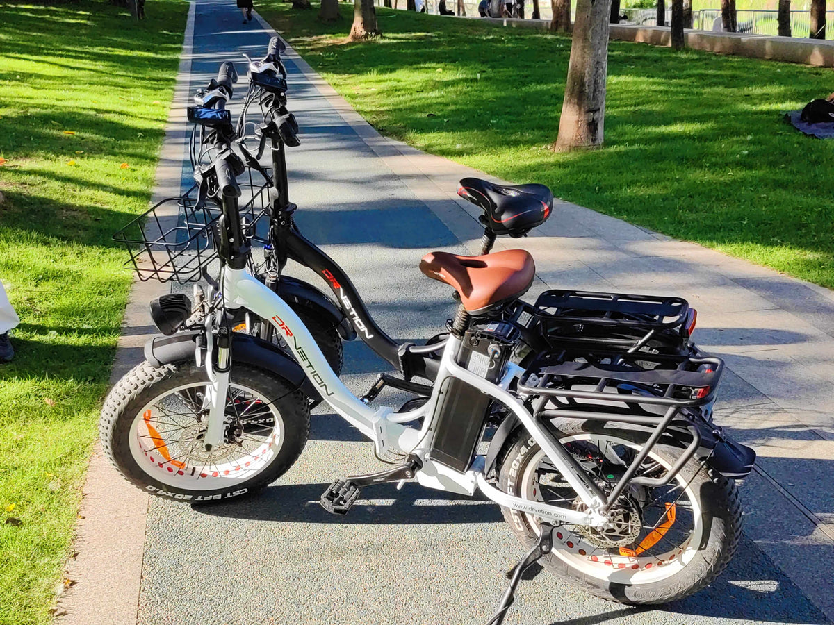 Drvetion CT20 — two e-bikes parked beside a park path